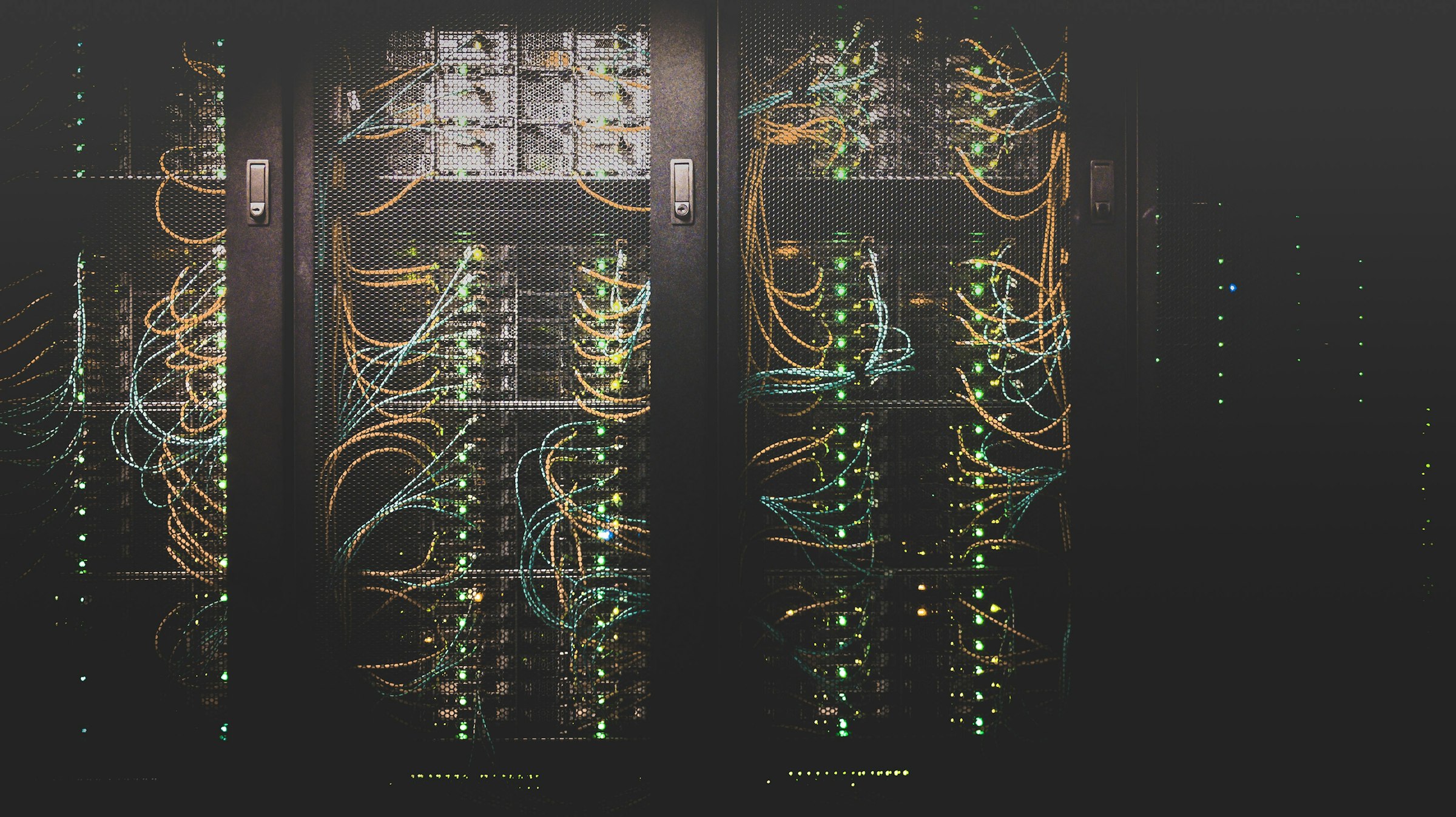 Data center hallway with network cabling